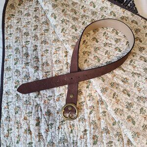Below the belt brown leather belt